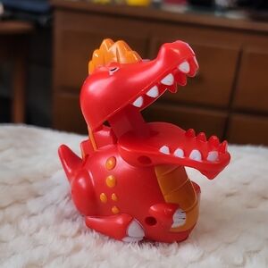 Toysmith Dino Press N' Go Zoomster Fugure.